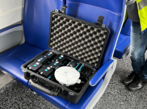 Image of sensor in a travel case on a train seat